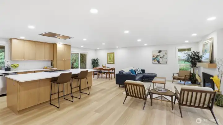 The open-concept great room is filled with natural light, creating an inviting space for both everyday living and entertaining. The open-concept great room is filled with natural light, creating an inviting space for both everyday living and entertaining.