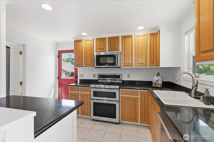 Kitchen with granite counters and stainless steel appliances