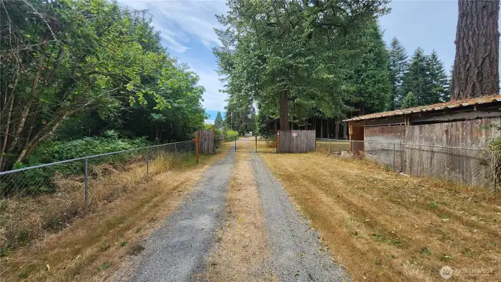 Existing owned  gated driveway connects property to Dennis Street