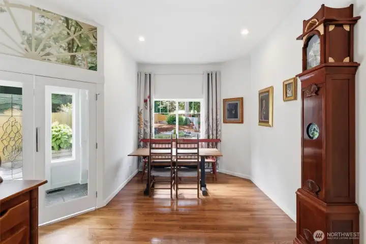 Beautiful dining area with natural light, water views, and beautiful hardwood floors
