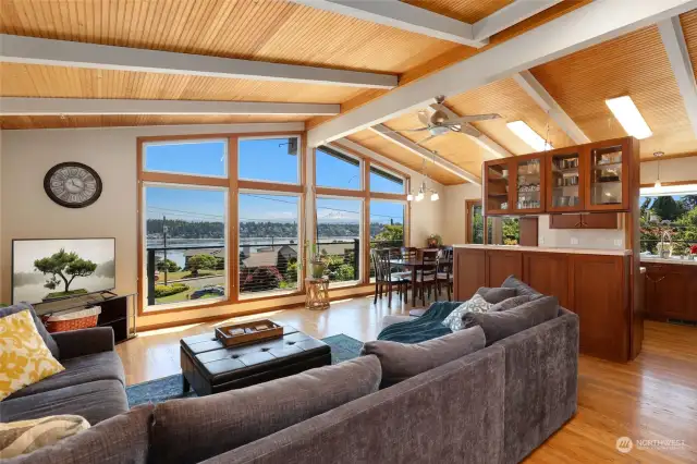 Don't let the stunning view take your attention away from the beautiful wood vaulted ceilings in this open living space.
