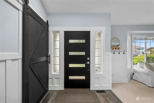 Custom-made barn style doors and craftsman wainscoting throughout the home! No detail has been ignored in the remodel of this home.