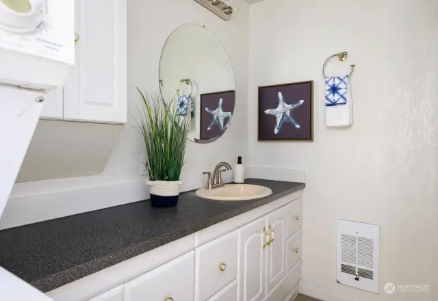 Downstairs 3/4 bathroom with laundry.