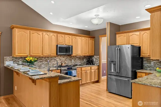 Kitchen in center area between formal dining room and great room area. Plenty of cabinets.