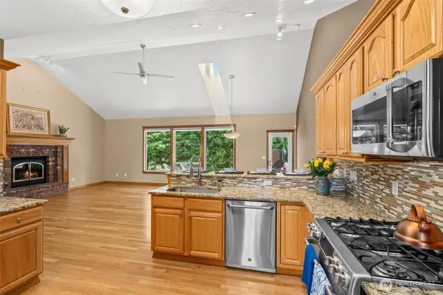Hardwood floors throughout kitchen/dining area and great room floor plan.