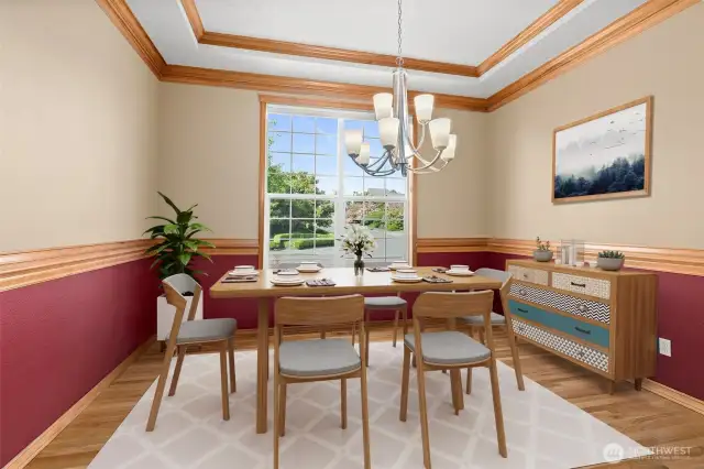 Virtually staged. Double crown molding and chair railing with defined color to entertain your guests.
