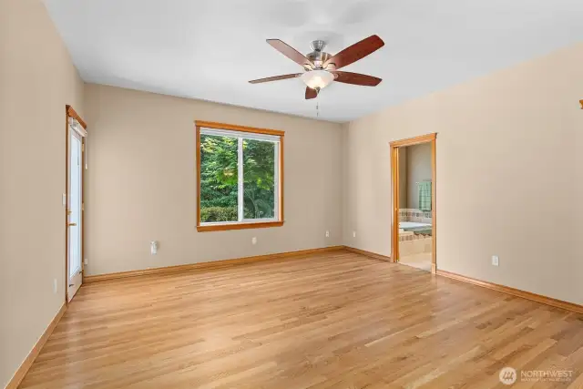 Master bedroom with a different angle of side door to patio.