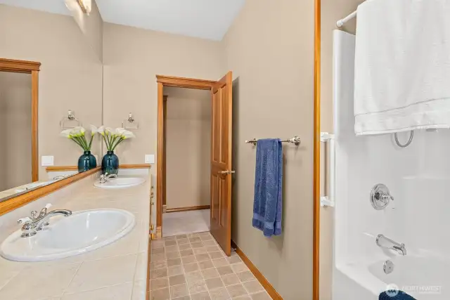Double sinks in this full bathroom.  Tub and shower combo.