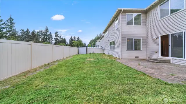 Backyard has a patio and storage, fully fenced and backs up to open space.