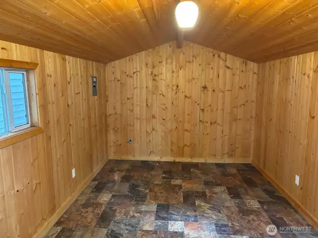 Outdoor shed with power has a new roof.