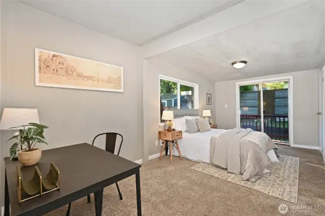Primary bedroom with slider to back yard