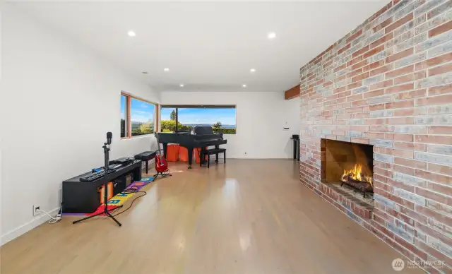 The lower level features high ceilings, hardwood floors, a gas fireplace and beautiful views.