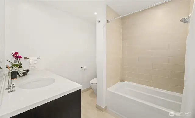 The full bath on the lower level with heated floors.