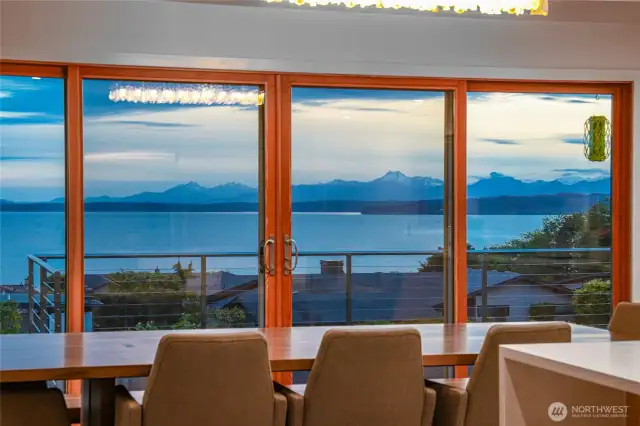 Slide open the dining/living area doors to the deck to open the space for seamless indoor-outdoor enjoyment.