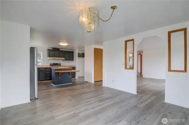 Open concept Living. From Dining Room view of Living Room and updated Kitchen.