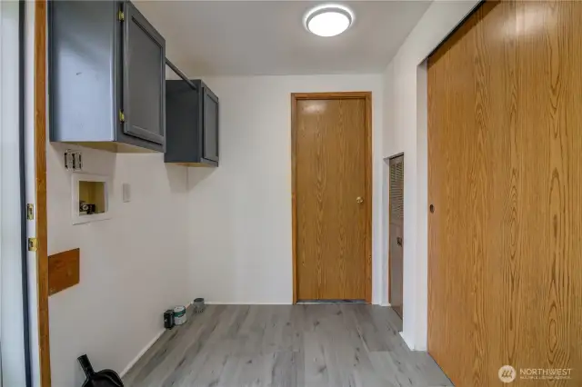 Laundry Space off the kitchen with more storage. Bathroom off of Laundry Room