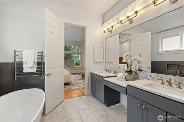 Completely remodeled primary bath with heated floors and heated towel rack.