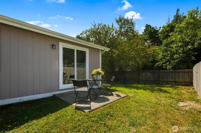Private patio and flat & grassy back & side yard for Unit A