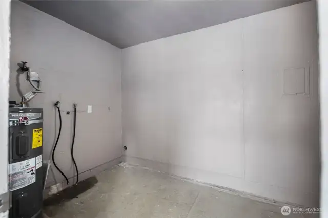 Unit A Storage and Laundry room with hook-ups for full-size washer/dryer