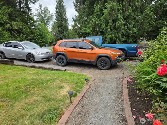 Uncovered parking for 8 cars, plus the carport and garage. RV parking with hook up! 4 uncovered spots on each driveway for company or the car collection.