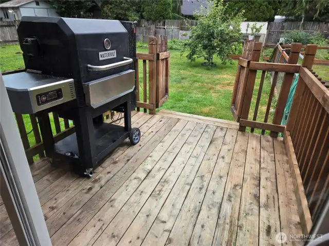 Grilling porch with gate to keep the dogs out and the small humans in.