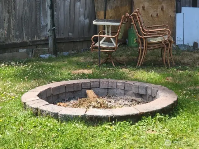 Fire pit to enjoy out back.