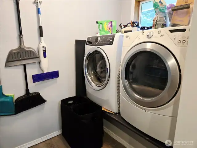 Lifted washer and dryer currently but would stack on the mop wall giving space for a full bathroom.