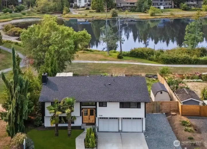The home boasts a rare expansive 180-degree view of Hilton Lake, framed by lush evergreens and tranquil water. A rare setting that captures both privacy and a sense of connection to nature.