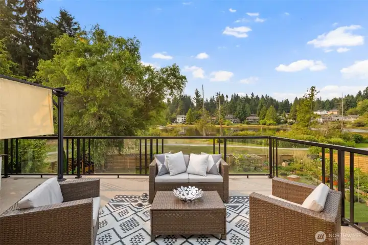 With its southerly exposure, this expansive deck offers front-row seats to breathtaking sunsets over the water. Imagine evenings spent here, savoring golden reflections dancing across the lake, all from the comfort of your own private retreat.