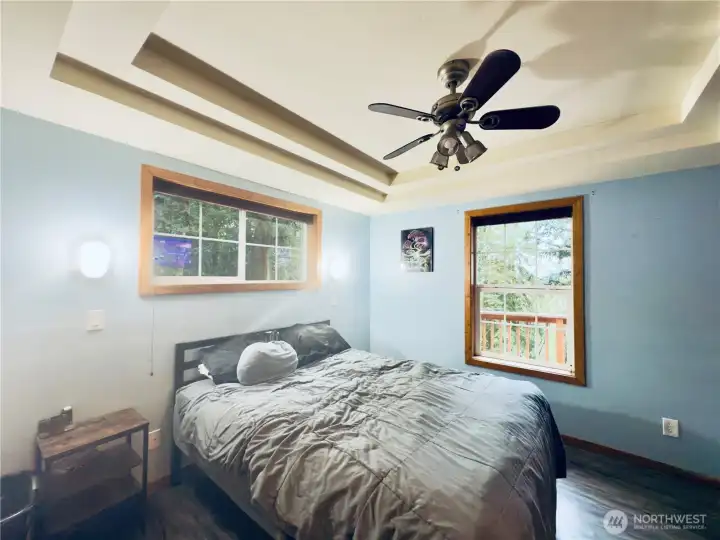 Bedroom: LPV flooring, built ins, ceiling fan, tray ceiling, views of the Columbia River