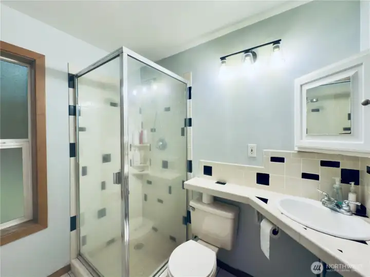 Large Bathroom: builtin, bathtub, tile, shower