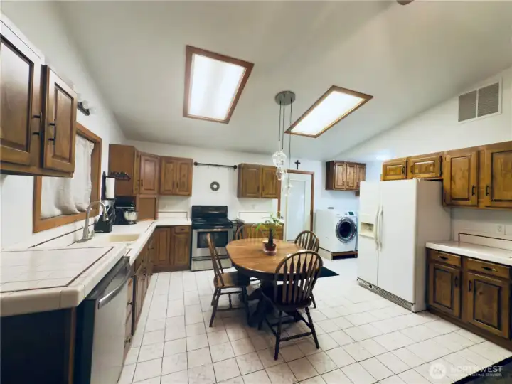 Dine in Kitchen: refrigerator, stove, dishwasher, plenty of cabinets, tile