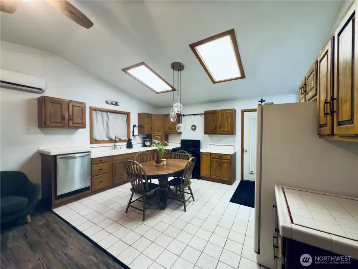 Dine in Kitchen: refrigerator, stove, dishwasher, plenty of cabinets, tile