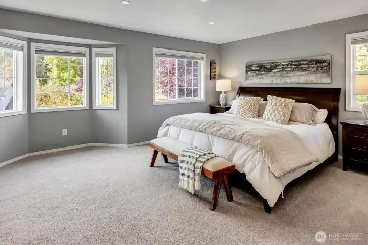 Large Primary Room with seating space in bay window area.