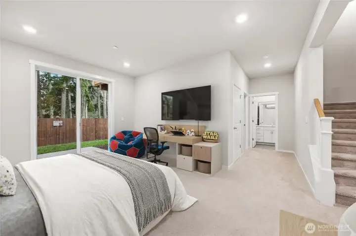 Huge bedroom downstairs with a 3/4 bath and additional storage. Walk out to your patio and yard. Photo's are for representational purposes only. Colors and finishes may differ.