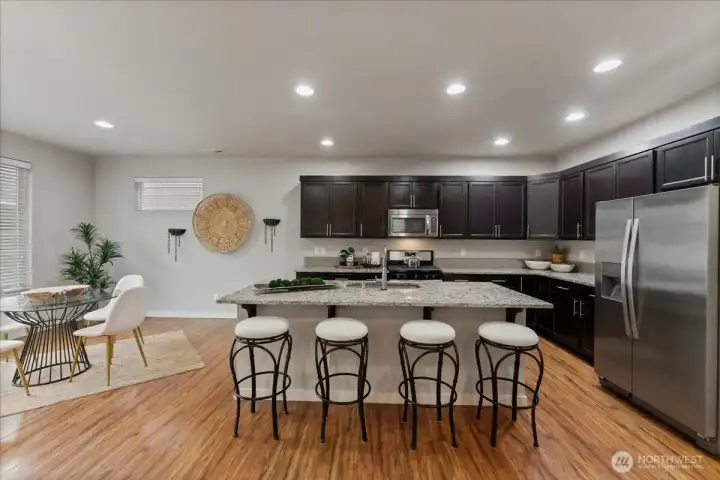 Large center island with seating—perfect for casual meals and gathering with guests.