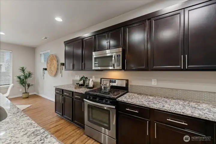 Kitchen features a gas range, ideal for cooking enthusiasts who appreciate precision and performance.