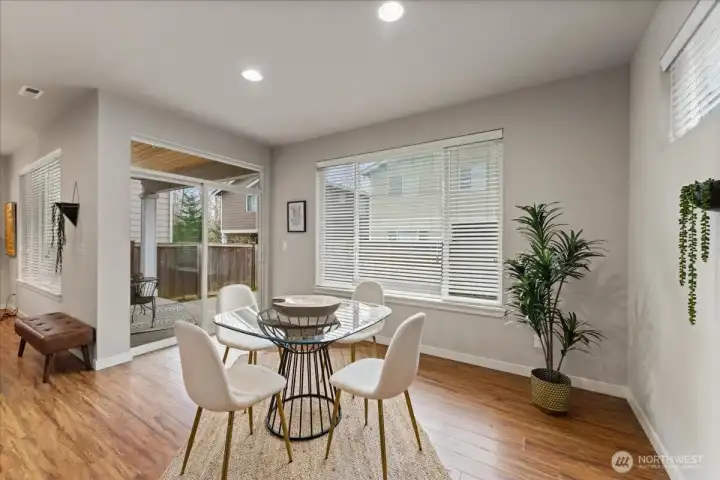 Dining area opens seamlessly to the kitchen and covered patio, creating effortless indoor-outdoor flow for entertaining.