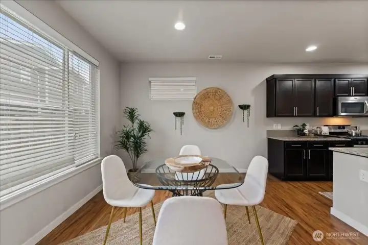 Bright and open dining space perfectly positioned off the kitchen for easy entertaining.