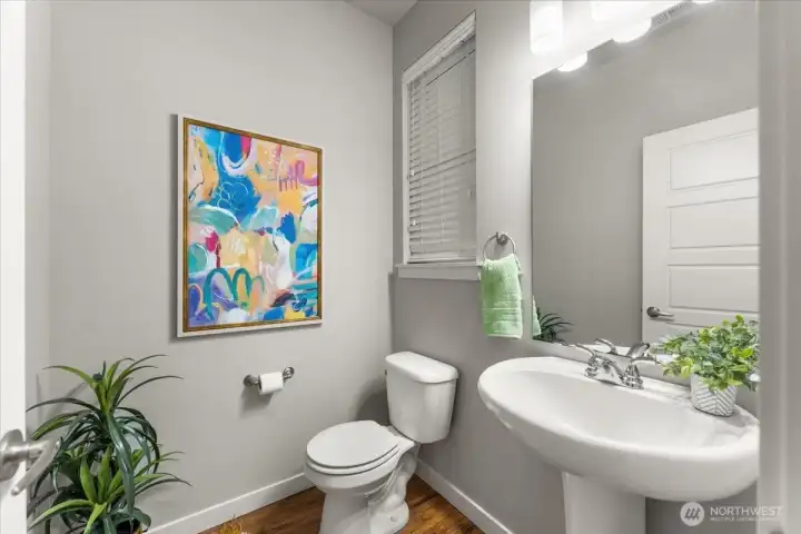 Convenient main-level half bath perfectly situated for guests.