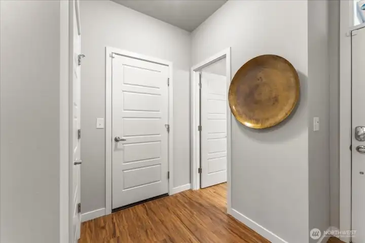 Door leads to the garage... it is an oversized two-car garage offering ample storage space plus a bump out area with room for tools, hobbies or a workbench.