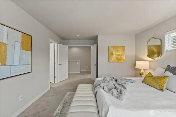 Spacious primary bedroom retreat featuring elegant French doors and plenty of room for a sitting area or private escape.