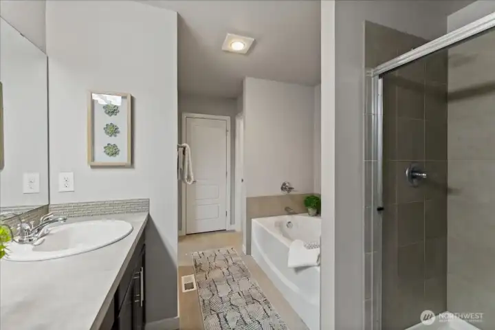 Relax and unwind in the luxurious soaking tub with a separate walk-in shower for added convenience.