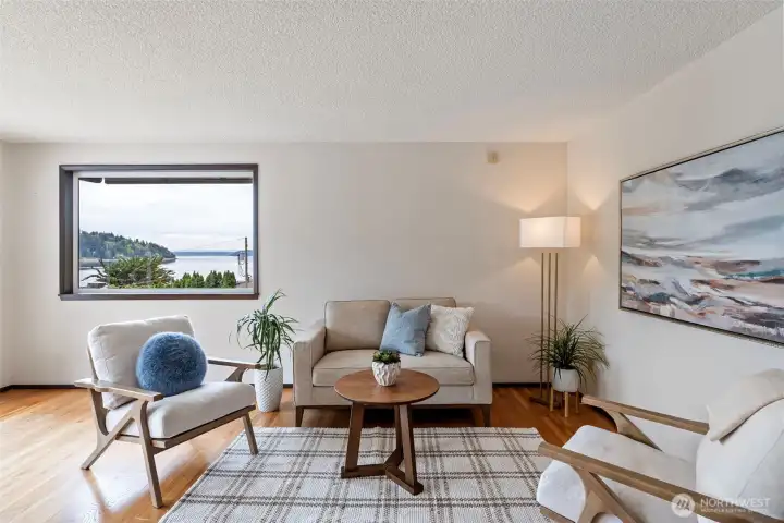 This area is just off the kitchen and can be used as a nook/reading area, or just a great place to visit with guests.  There are lovely water views from almost every room.