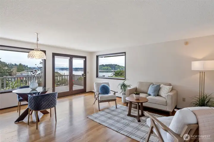 French doors lead to the expansive deck which invites entertaining and relaxing.