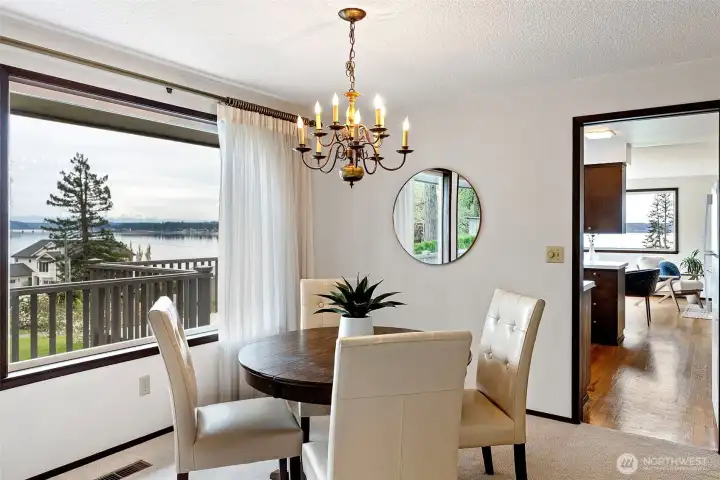 The dining room is located just off the kitchen and also enjoys beautiful views of Mt. Rainier, Fox Island, and Hale Pass.