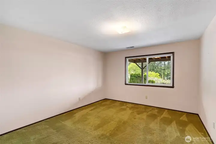 One of the two bedrooms in the lower level, which also has views of Mt. Rainier and the Sound.