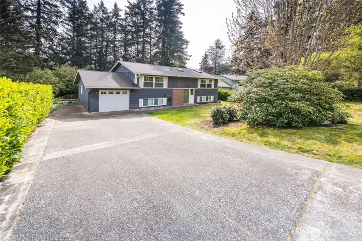 A home that blends comfort and function with a generous driveway and ample parking.