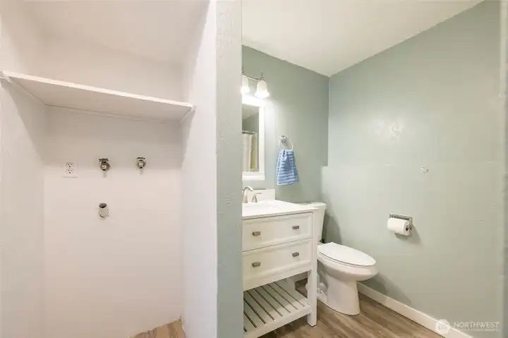 Another view of the laundry area and full bath on the lower level.