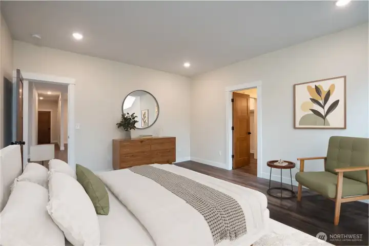 Large primary suite with private 4 piece bathroom featuring dual vanities.   Virtually staged.